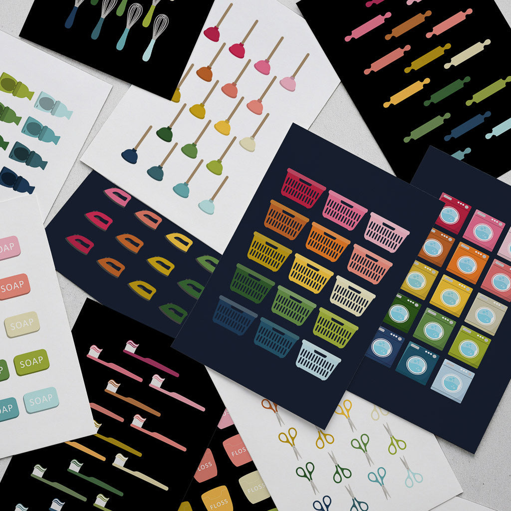 Pile of modern, minimalist graphic art prints in rainbow colors featuring household items like whisks, scissors, toothbrushes, baskets, soap, and rolling pins