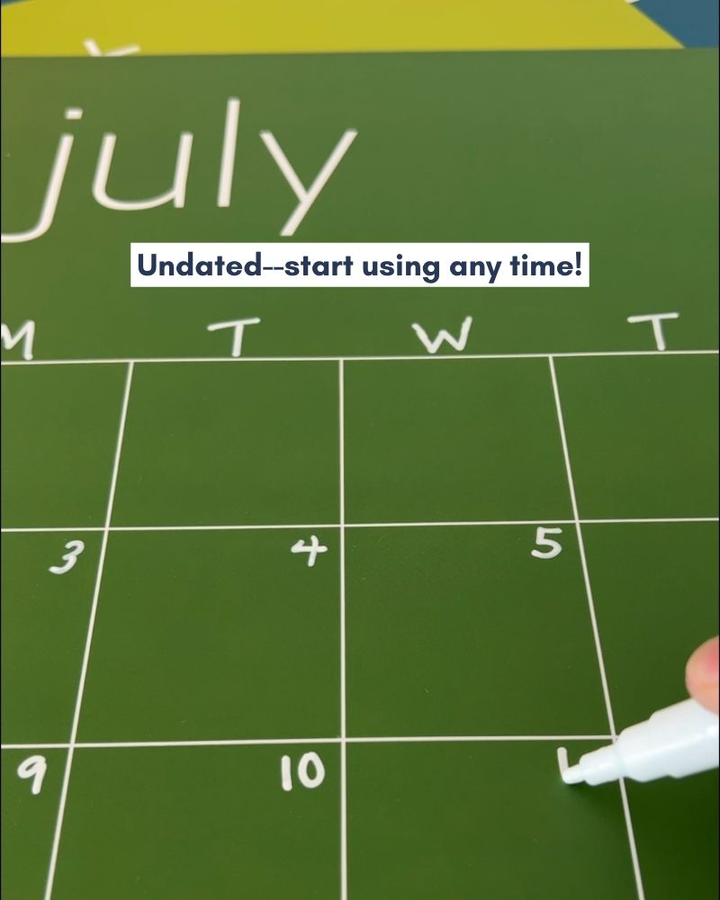 Close up of the July page of a green reusable calendar with the words "Undated--start using any time!"