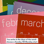 Graphic of a stack of the reusable rainbow wall calendars from Kaleidoscope Living with a graphic saying "You write in the days of the week--choose a Sunday OR Monday start."