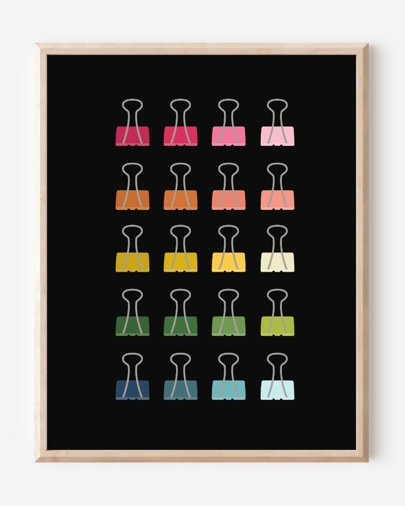 Modern art print of colorful binder clips in rainbow hues arranged in a minimalist grid on a black background.