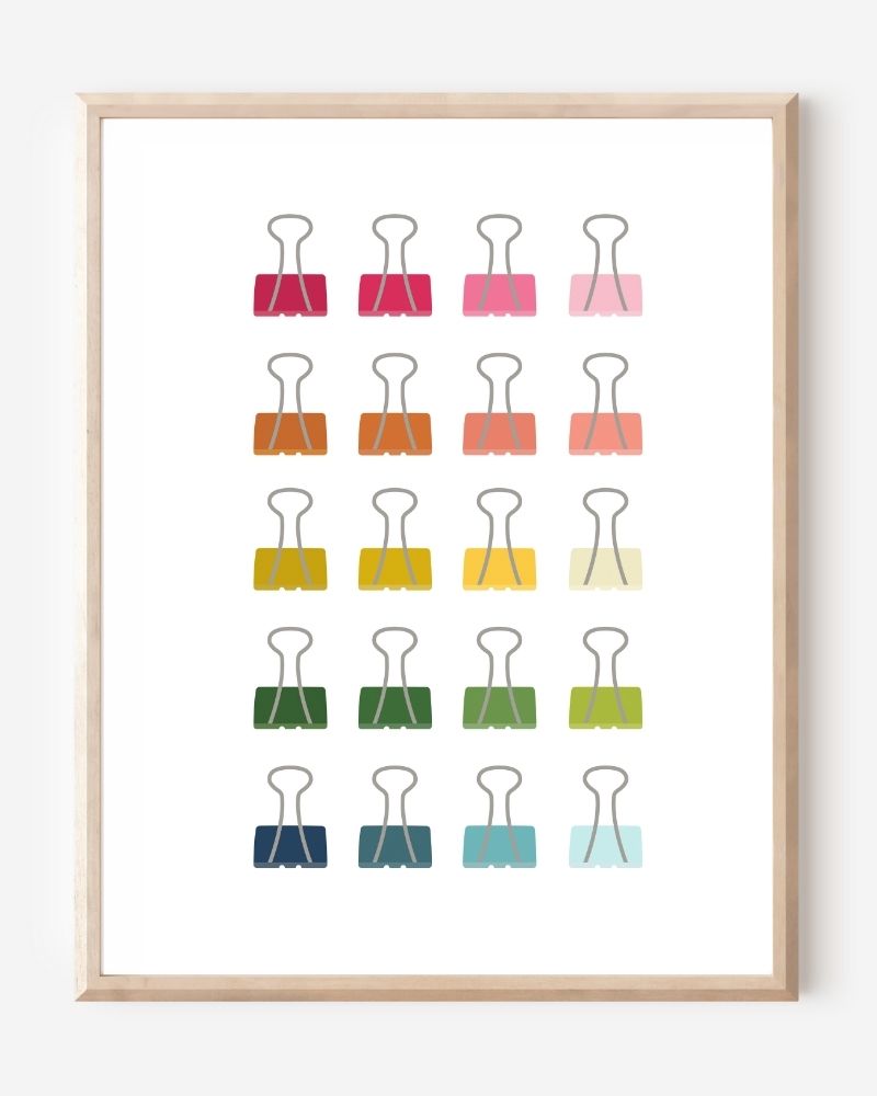 Modern art print of colorful binder clips in rainbow hues arranged in a minimalist grid on a white background.