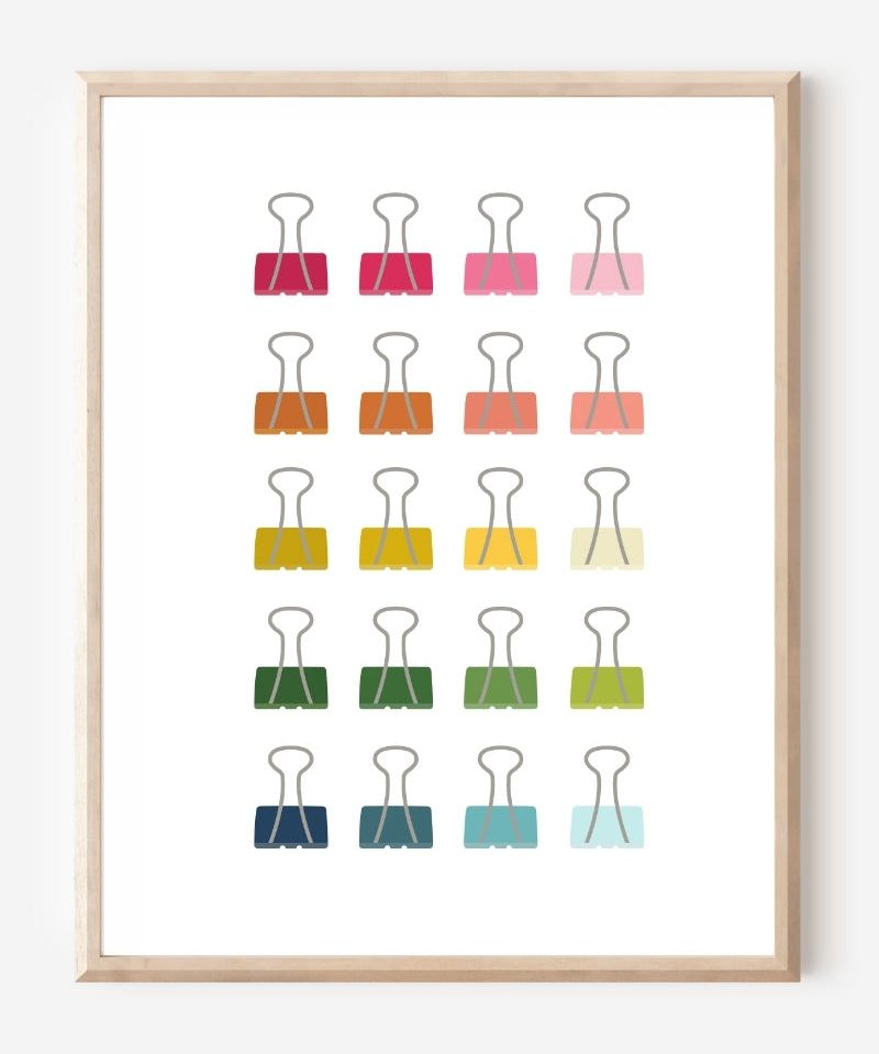 Modern art print of colorful binder clips in rainbow hues arranged in a minimalist grid on a white background.
