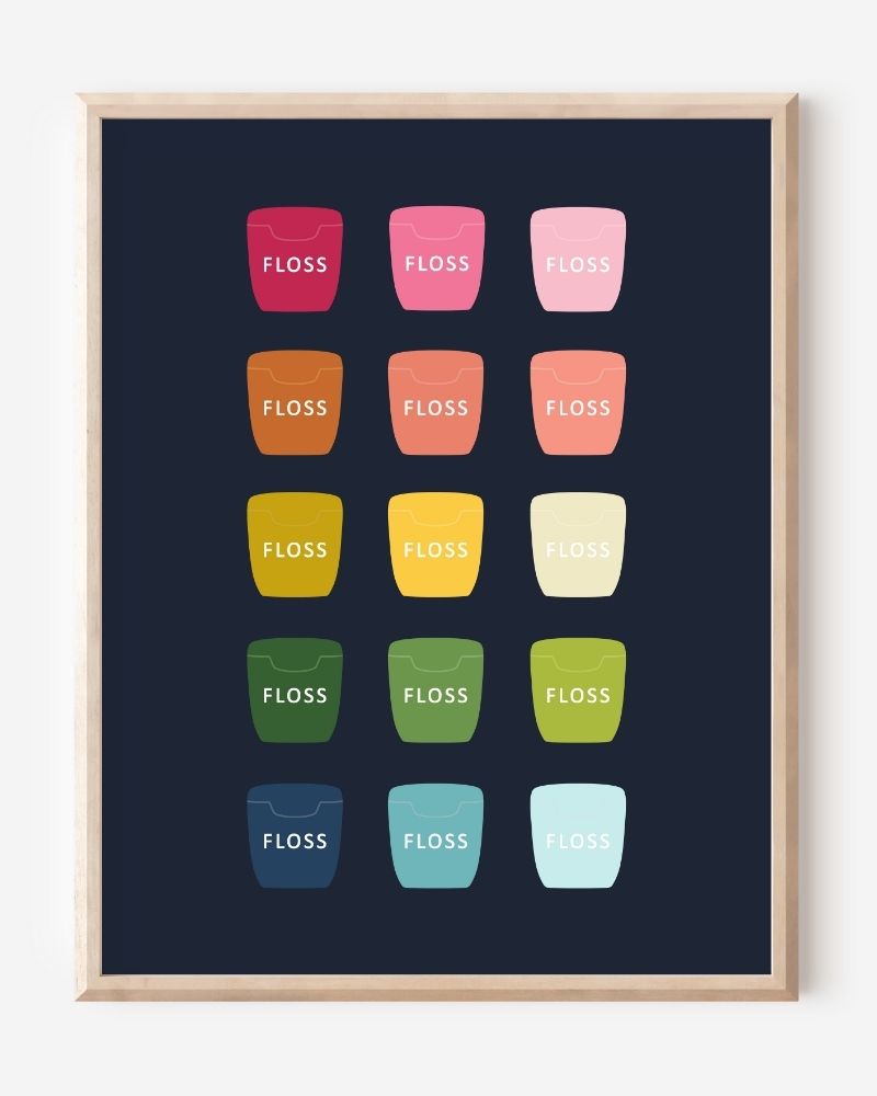 Bathroom wall art print of dental floss containers in rainbow hues arranged in a modern grid on navy background.