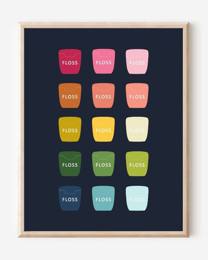 Bathroom wall art print of dental floss containers in rainbow hues arranged in a modern grid on navy background.