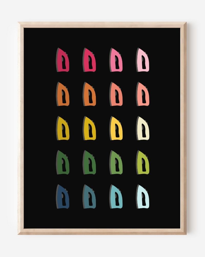 Laundry room wall art print of irons in rainbow hues arranged in a modern grid on a black background--a fun pop of color for laundry or utility spaces.