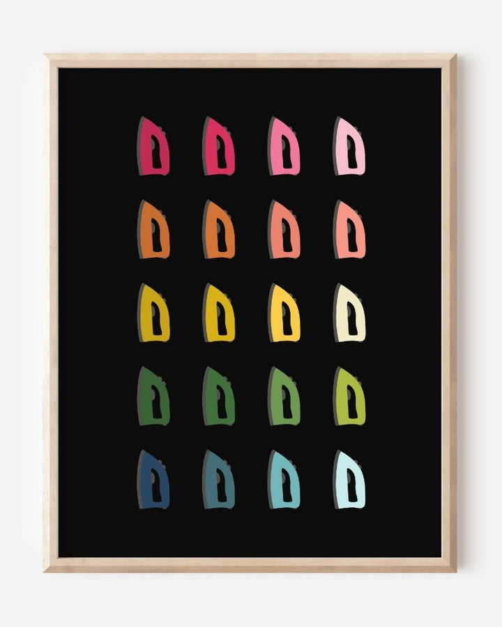 Laundry room wall art print of irons in rainbow hues arranged in a modern grid on a black background--a fun pop of color for laundry or utility spaces.
