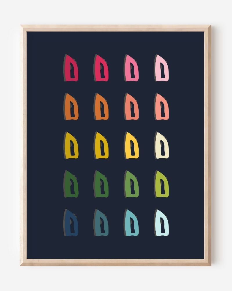 Laundry room wall art print of irons in rainbow hues arranged in a modern grid on a navy blue background--a fun pop of color for laundry or utility spaces.
