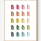 Laundry room wall art print of irons in rainbow hues arranged in a modern grid on a white background--a fun pop of color for laundry or utility spaces.