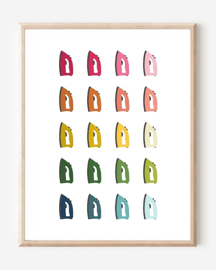 Laundry room wall art print of irons in rainbow hues arranged in a modern grid on a white background--a fun pop of color for laundry or utility spaces.