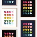 Framed art prints featuring minimalist illustrations of Measuring Cups in rainbow hues on black, navy blue and white backgrounds.