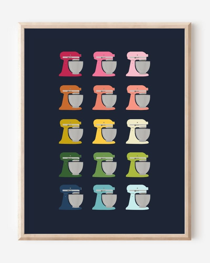Graphic kitchen art print of colorful stand mixers in rainbow hues on navy background.