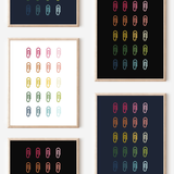 Framed art prints featuring minimalist illustrations of Paper Clips in rainbow hues on black, navy blue and white backgrounds.