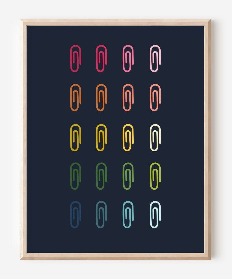 Minimalist modern wall art print featuring colorful paper clips in rainbow colors arranged neatly in a grid on a navy background.
