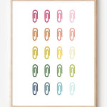 Minimalist modern wall art print featuring colorful paper clips in rainbow colors arranged neatly in a grid on a white background.