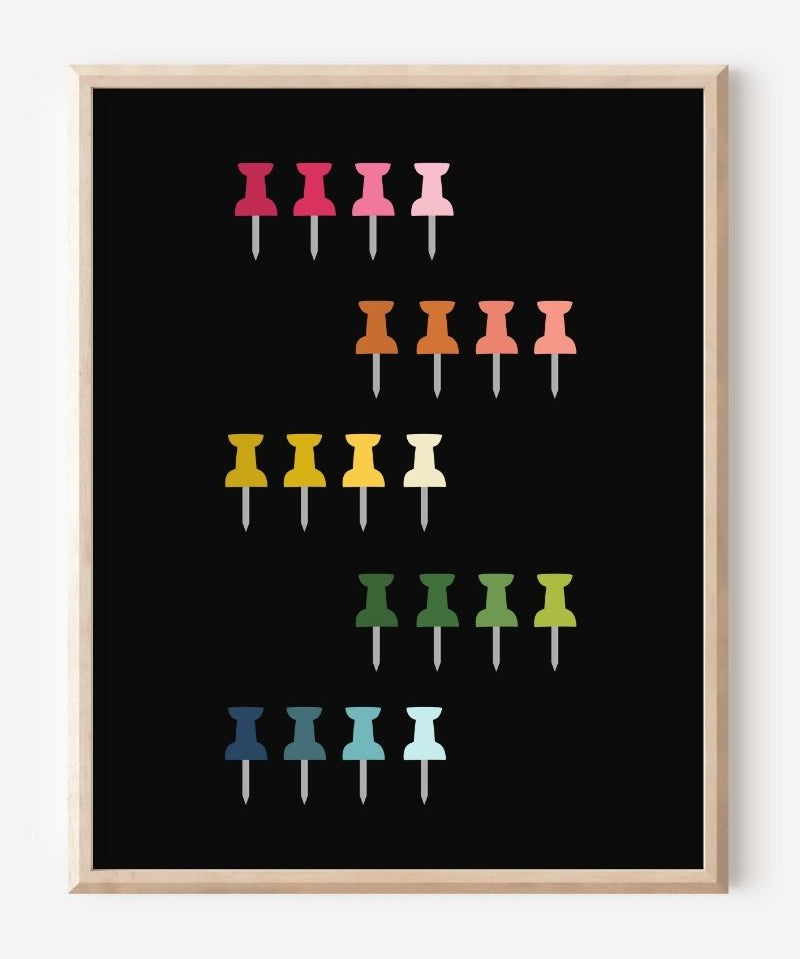 Graphic art print showing colorful push pins in rainbow colors laid out in a clean grid on a black background, playful modern wall art for studios and offices.