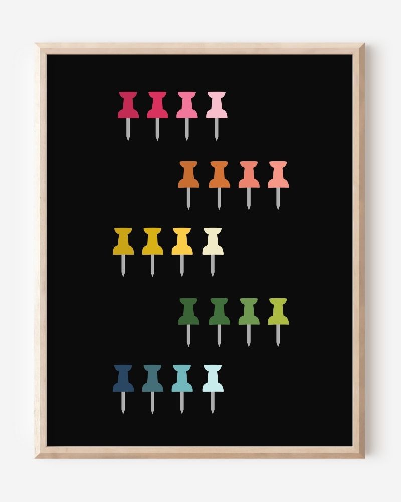 Graphic art print showing colorful push pins in rainbow colors laid out in a clean grid on a black background, playful modern wall art for studios and offices.