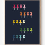 Graphic art print showing colorful push pins in rainbow colors laid out in a clean grid on a navy background, playful modern wall art for studios and offices.