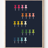 Graphic art print showing colorful push pins in rainbow colors laid out in a clean grid on a navy background, playful modern wall art for studios and offices.
