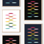 Framed art prints featuring minimalist illustrations of Rolling Pins in rainbow hues on black, navy blue and white backgrounds.