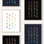 Framed art prints featuring minimalist illustrations of Scissors in rainbow hues on black, navy blue and white backgrounds.