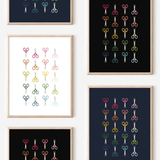 Framed art prints featuring minimalist illustrations of Scissors in rainbow hues on black, navy blue and white backgrounds.