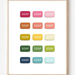 Graphic art print of bars of soap in rainbow hues arranged in neat rows on white background.