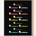 Modern bathroom art print of toothbrushes in rainbow colors arranged in rows on black background.
