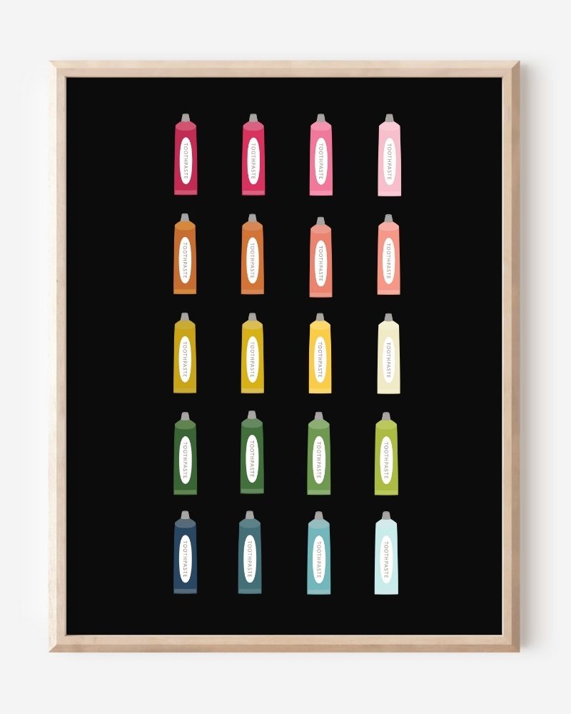 Minimalist bathroom wall art print showing colorful toothpaste tubes in a grid on a black background.