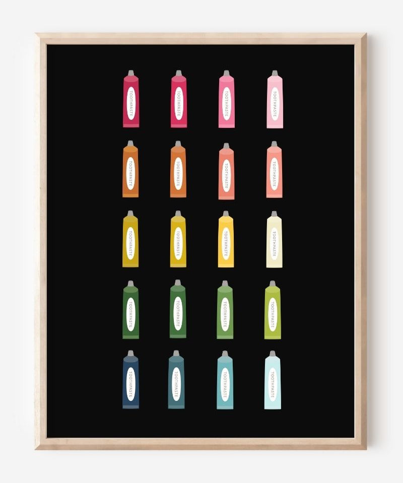 Minimalist bathroom wall art print showing colorful toothpaste tubes in a grid on a black background.