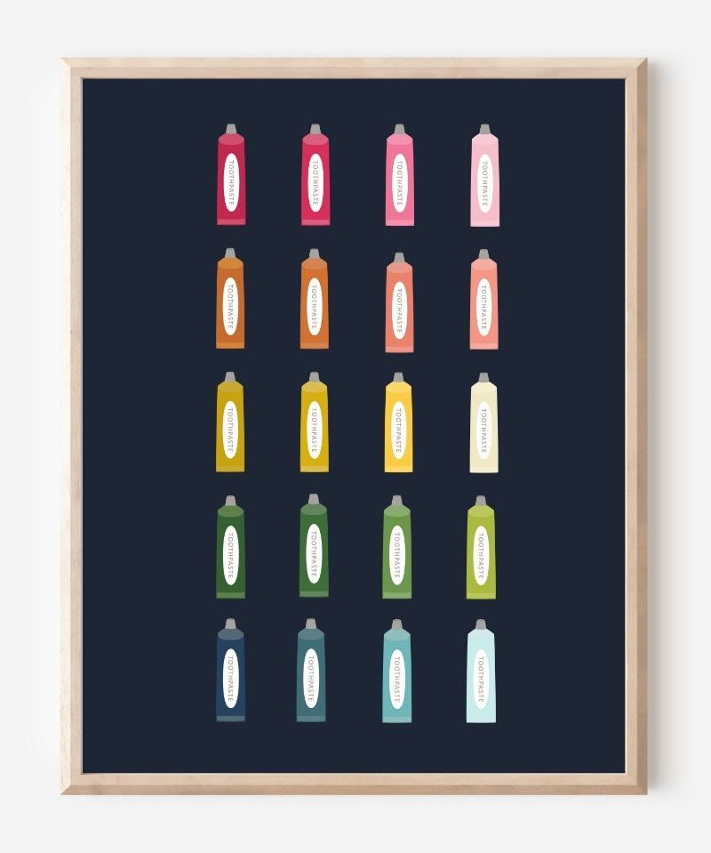 Minimalist bathroom wall art print showing colorful toothpaste tubes in a grid on a navy background.