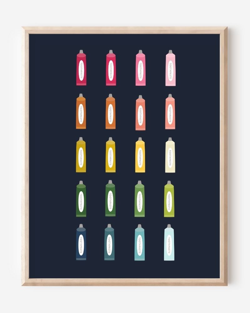 Minimalist bathroom wall art print showing colorful toothpaste tubes in a grid on a navy background.