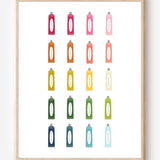 Minimalist bathroom wall art print showing colorful toothpaste tubes in a grid on a white background.