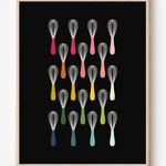 Kitchen wall art showing simple graphic whisks in ombre rainbow hues arranged in rows on a black background.