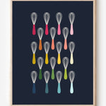 Kitchen wall art showing simple graphic whisks in ombre rainbow hues arranged in rows on a navy background.