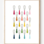 Kitchen wall art showing simple graphic whisks in ombre rainbow hues arranged in rows on a white background.