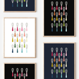 Framed art prints featuring minimalist illustrations of Wisks in rainbow hues on black, navy blue and white backgrounds.