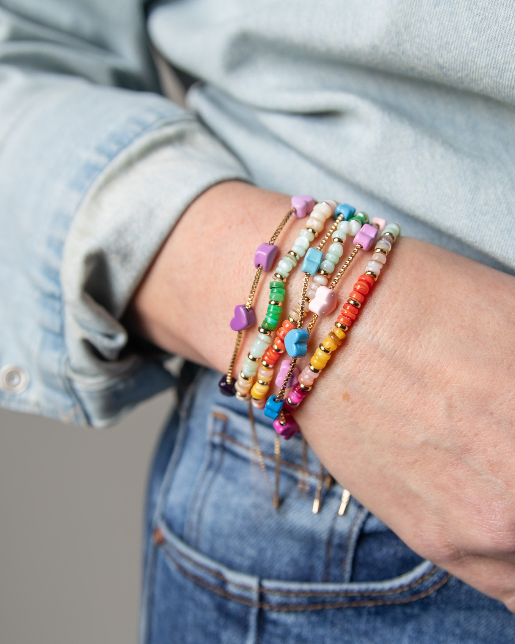 Close up of a stack of colorful bracelets from Kaleidoscope Living.