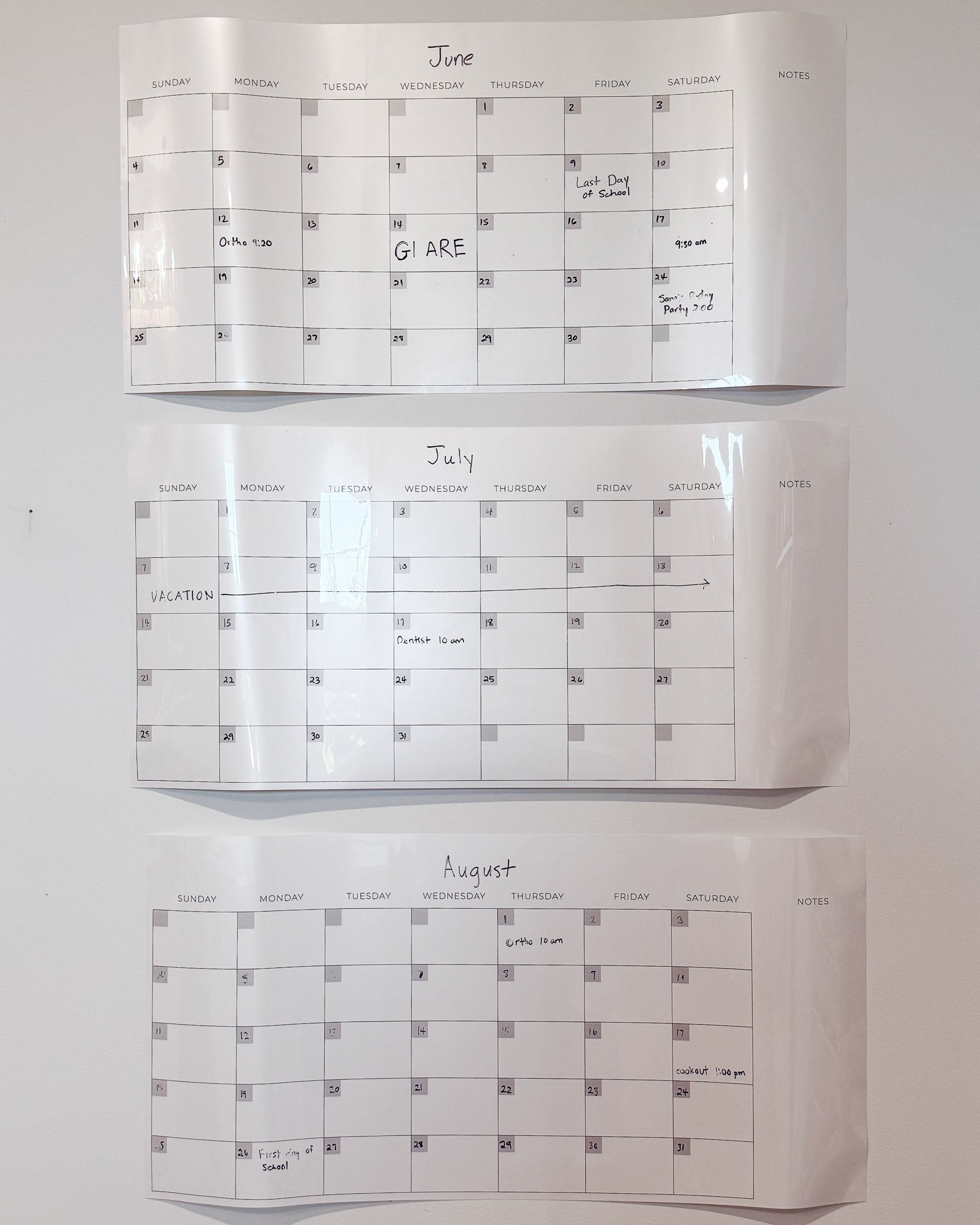 White dry-erase calendar with glare