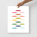 kitchen art print with a white background and grid of colorful clip art of rolling pins in ombre rainbow colors ranging from pinks to blues