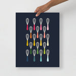 kitchen art print with a navy background and grid of colorful clip art of whisks in ombre rainbow colors ranging from pinks to blues