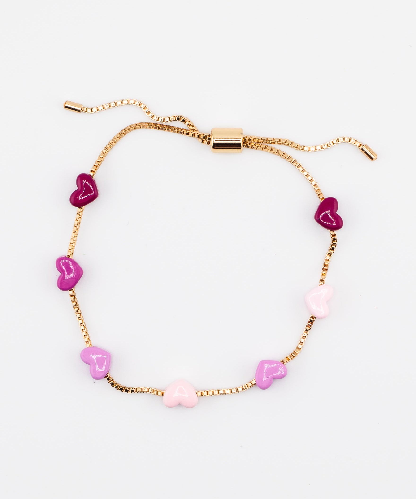Adjustable gold chain bracelet with pink enamel hearts from Kaleidoscope Living.