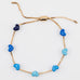 Gold chain bracelet with blue enamel hearts from Kaleidoscope Living.
