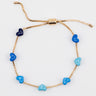 Gold chain bracelet with blue enamel hearts from Kaleidoscope Living.