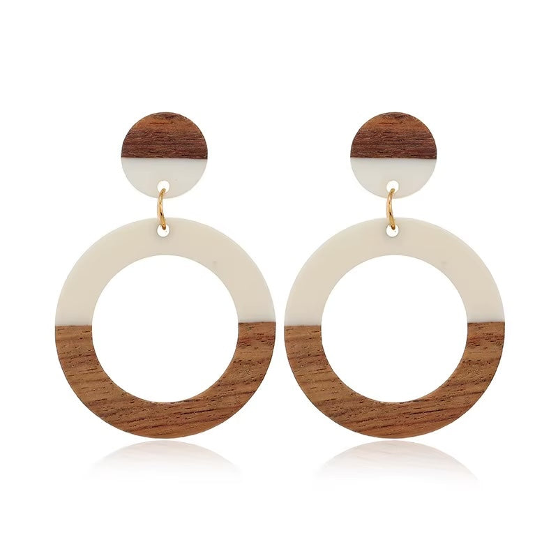 Round drop earrings made of wood and ivory-toned acrylic resin by Kaleidoscope Living