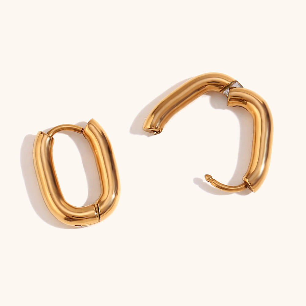 Gold oval huggie earrings with a smooth finish by Kaleidoscope Living.