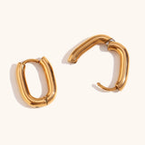Gold oval huggie earrings with a smooth finish by Kaleidoscope Living.