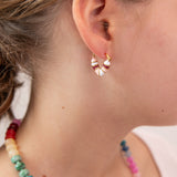 Close up of girl with heart shaped huggie in white, pink and red tones