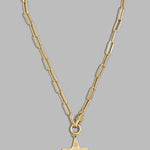 A gold paperclip chain necklace with a textured star-shaped pendant, displayed against a solid gray background.