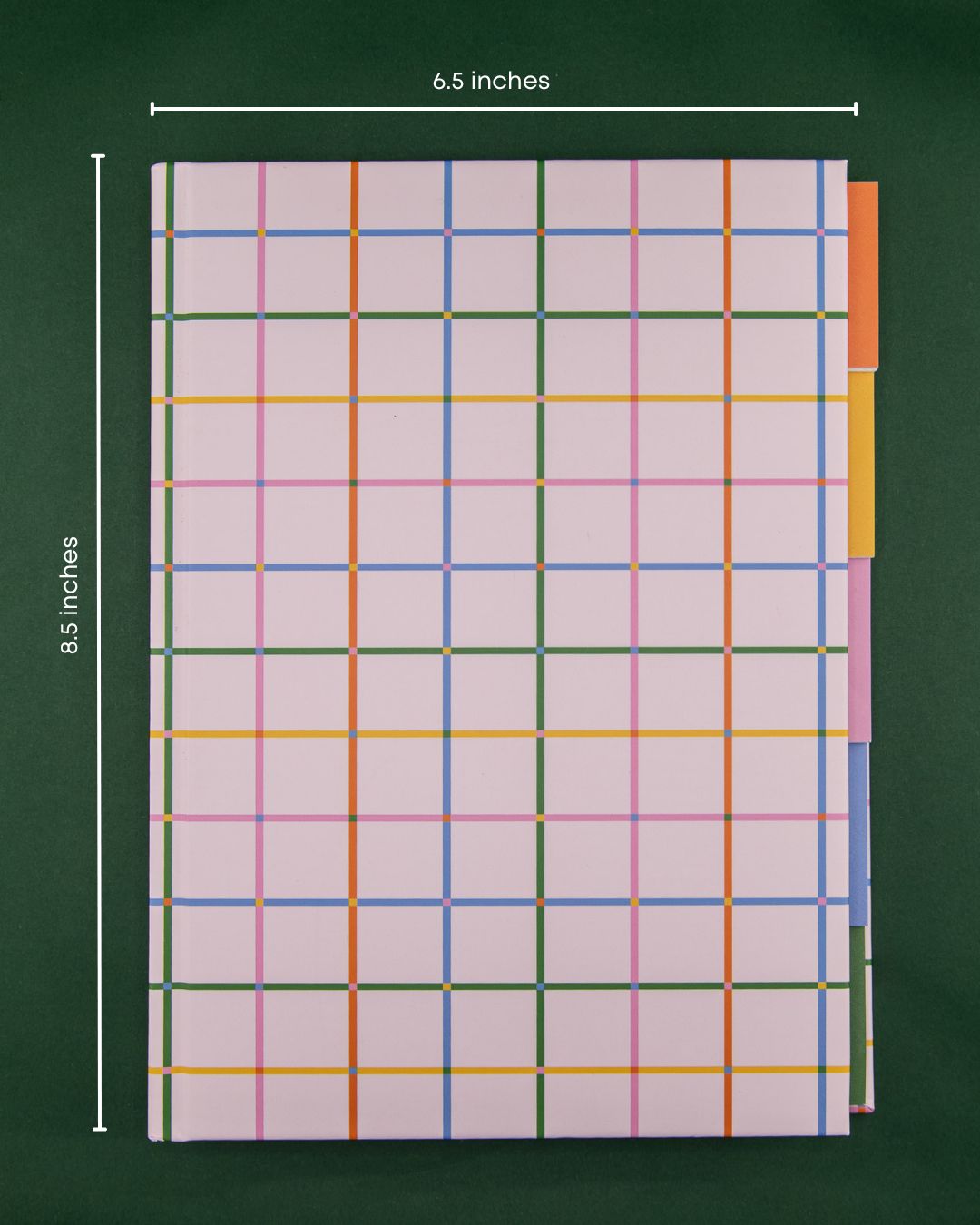 A hardcover tabbed notebook with a colorful plaid design of multicolored grid lines on a dark green background, showing dimension markers of 6.5 inches by 8.5 inches