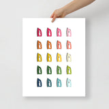 laundry room art print with a white background and grid of colorful clip art of irons in ombre rainbow colors ranging from pinks to blues